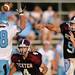 Skyline senior Grant Shepherd attempts to break up Dexter senior Michael Mioduszewski pass as Dexter senior Jacob Stegemann looks on during the first quarter against Skyline at Dexter on Friday night.